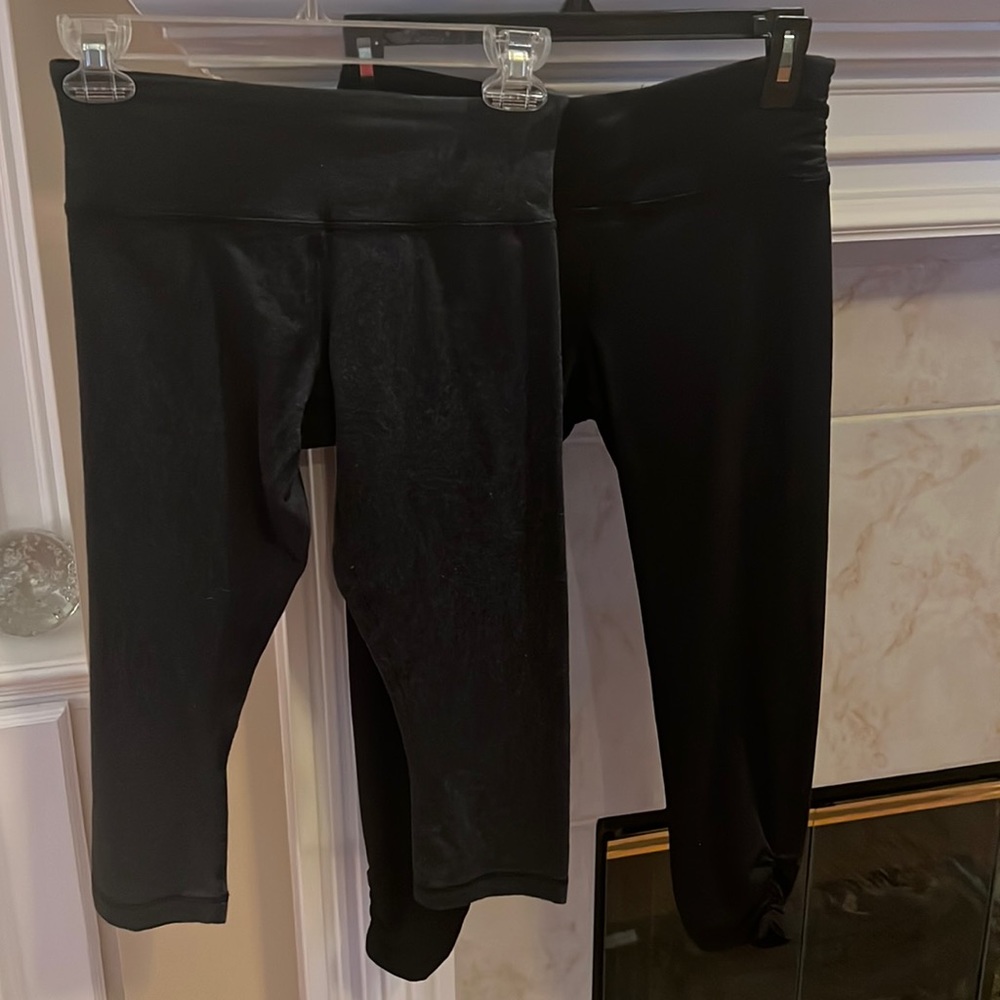 Two pair of black/ gray capris in small.
